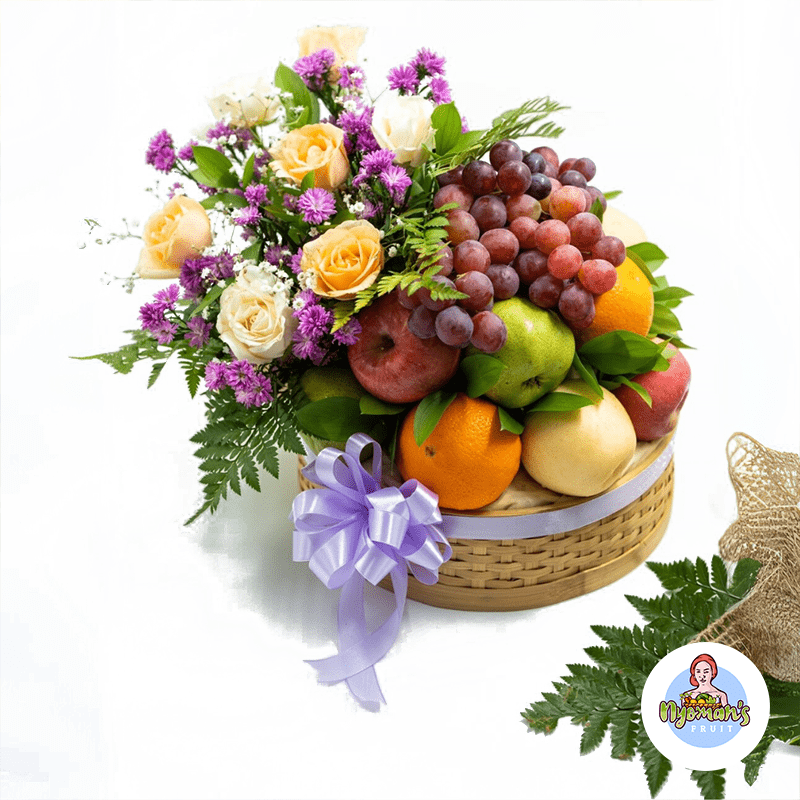 Frangipani Cascade 2 Frangipani Cascade fruit hamper Bali dalam keranjang bambu bulat dengan bunga dan buah segar